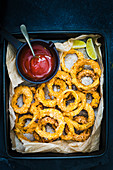 Airfried onion rings with tomato plum sauce