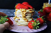 Pancakes with peanut butter and strawberries