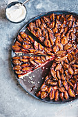 Damson tart with sugar nibs