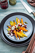 Colourful roasted carrots with pesto and feta cheese