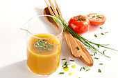 Homemade natural mango vinegar with chives and tomatoes