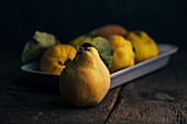 Quince fruits on dark wooden background