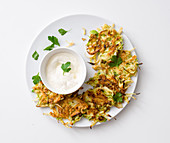Potato and brussels sprout fritters with sour cream