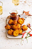 Vegan pumpkin fritters with chilli, miso and caramel dipping sauce