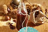 A bottle of homemade chestnut liqueur with cocoa and vodka