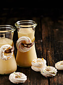 Homemade white chocolate liqueur decorated with meringue rings
