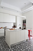 Island counter in white fitted kitchen