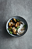 Oriental aubergine stew with rice noodles and sepia