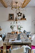 Rustic wooden table and Christmas decorations in dining room