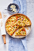 Vegetable tart topped with almonds