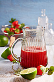 Homemade strawberry and lime syrup with fresh fruit