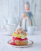 A profiterole filled with rhubarb compote and pistachio cream