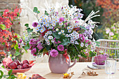 Autumn bouquet of chrysanthemums, autumn asters, ivy, box and Chinese reed