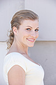 A blonde woman wearing a white shirt