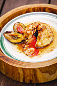 Stuffed quark dumplings with preserved plums and nut crumbs
