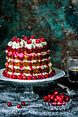 Biscuit multi-tier cake with cranberries and cream cheese and fresh cranberries