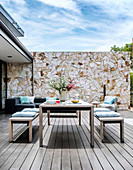 Table with benches on terrace with wooden deck