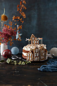 A Christmas cake decorated with gingerbread houses