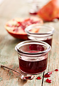 Homemade pomegranate syrup in jars