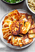 Fried halloumi served with grain