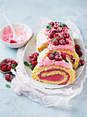 Swiss roll with yoghurt and raspberry filling, sliced