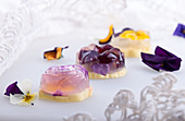 Unique japanese dessert Havaro of jelly and bavarian cream with edible violet flowers