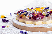 Unique japanese dessert Havaro of jelly and bavarian cream with edible violet flowers