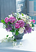 Bouquet of peonies, roses, flowering dogwood and alliums