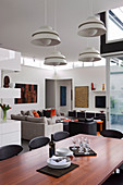 Modern open living room in designer style with dark furniture