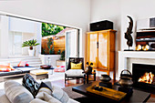 Exotic living room with an open window to the terrace