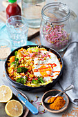 Fried rice with curry, veggies and egg