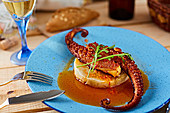 Squid arms served with sauce on polenta