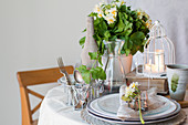 Spring table settings in green colors with Daffodils
