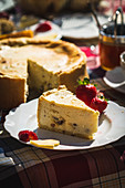Cheesecake with raisins outside on a breakfast table