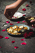Heart-shaped waffle with pistachios, rose cream and rose petals