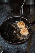 Scallops being Grilled on the Pan
