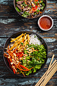 Vietnamese style noodles salad with fresh vegetables
