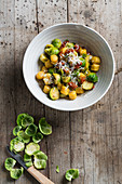 Pumpkin gnocchi with Brussels sprouts, dried tomatoes and Parmesan