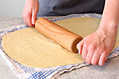 Strudel dough being rolled out