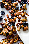 Roasted cashews, peanuts, almonds and dried cranberries in asian nut mix