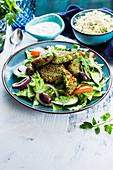 Kale falafel on a Mediterranean salad