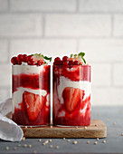 Strawberry yoghurt layered dessert in glasses