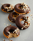 Hazelnut doughnuts with chocolate glaze and chopped hazelnuts