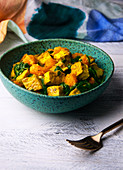 Vegan tofu curry with butternut squash and spinach (India)