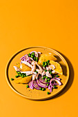 Turkey salad with oranges, peas and red onions