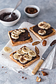 Toasts with vegan chocolate spread and banana slices