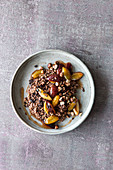 Gluten-free buckwheat and cocoa porridge with nuts and plums
