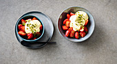 strawberries with a saffron topping and pistachio nuts