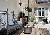 Sofa with country-house metal frame on wooden deck