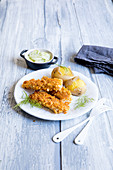 Homemade fish fingers with jacket potatoes